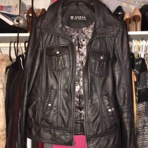 Black leather jacket with grey lining.